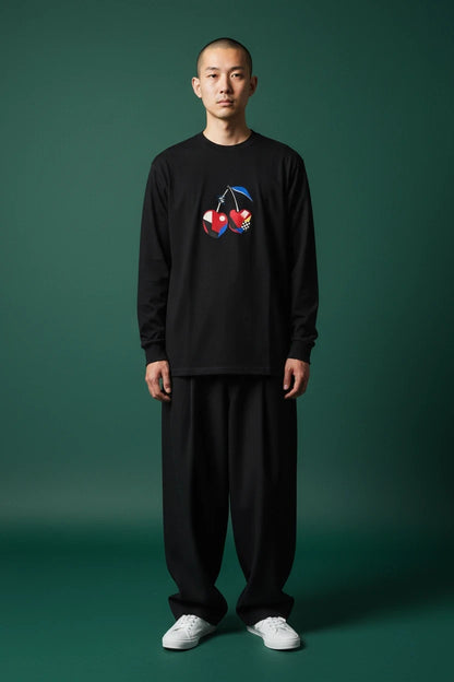ODD COMMON black long-sleeve t-shirt with a geometric cherry graphic featuring pixelated noise and checkered patterns.