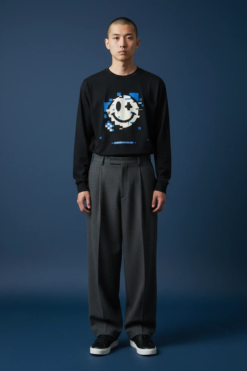 ODD COMMON black long-sleeve t-shirt featuring a blue and white glitchy pixelated smiley face graphic