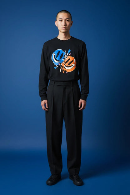 ODD COMMON black long-sleeve t-shirt featuring a blue and orange collision graphic of two smiley faces on the chest.